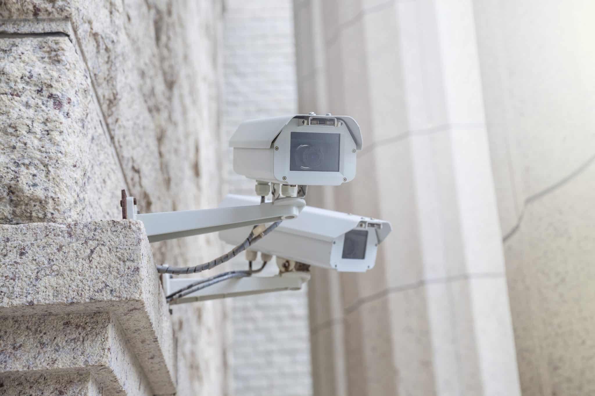 Wall mounted CCTV cameras on an office building.