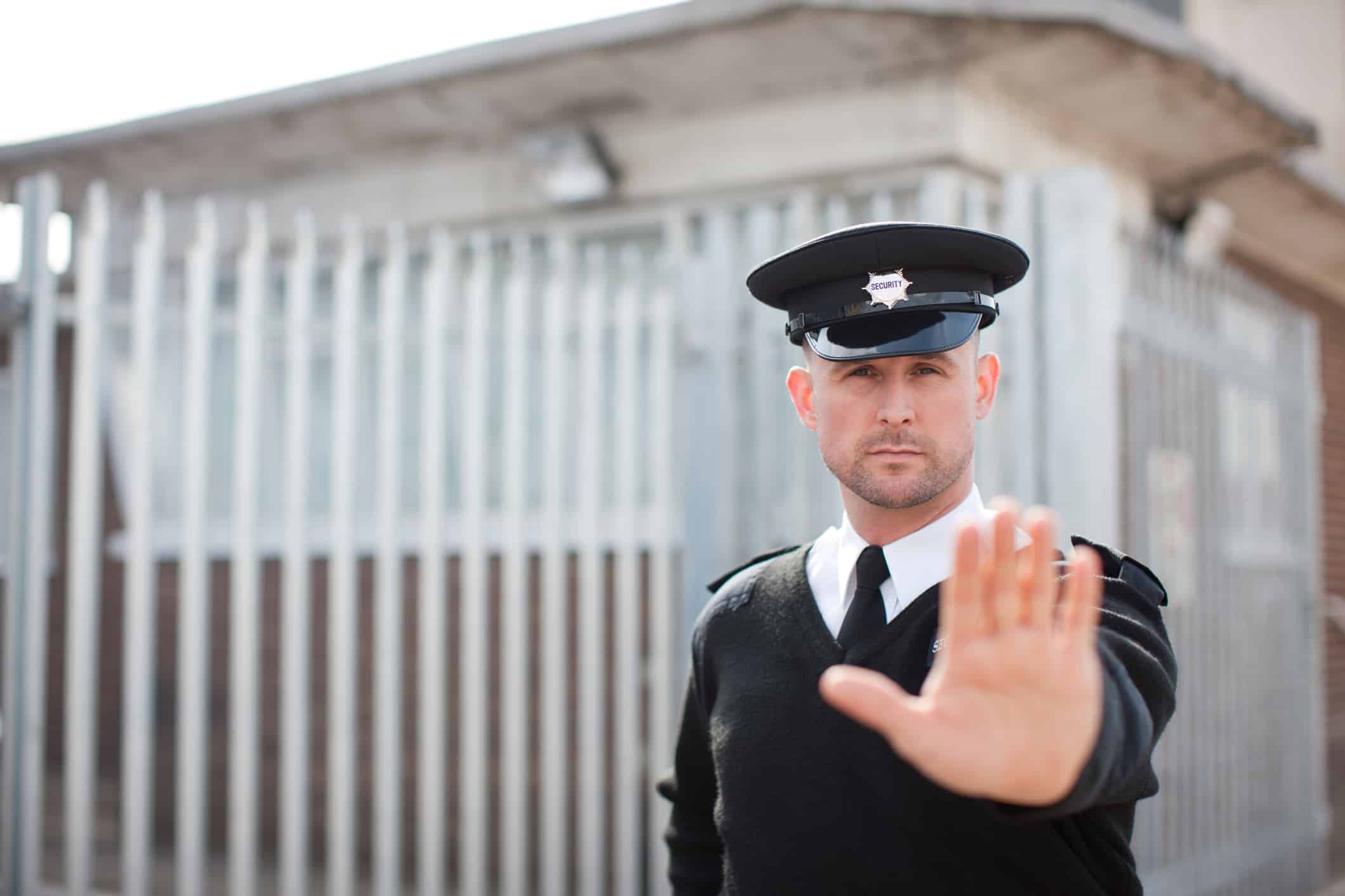 Security guard holding hand out